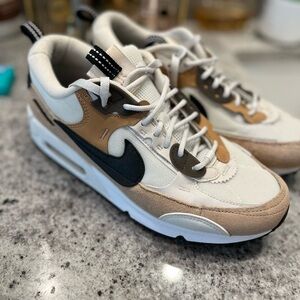 Nike Athletic Shoes in Black, White, and Tan